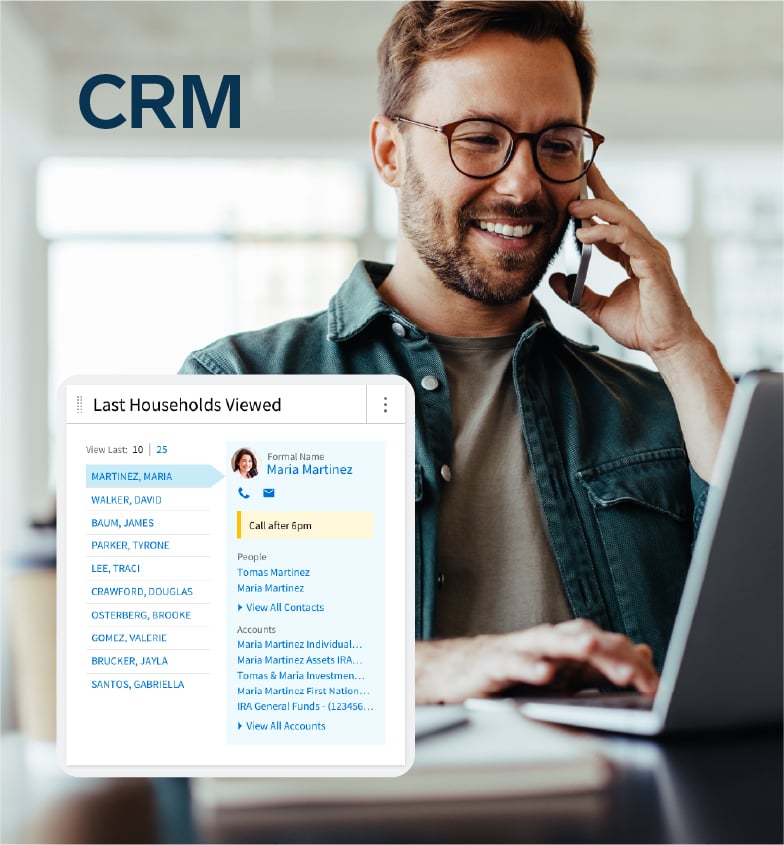CRM: man on phone, smiling, while accessing CRM tool on laptop
