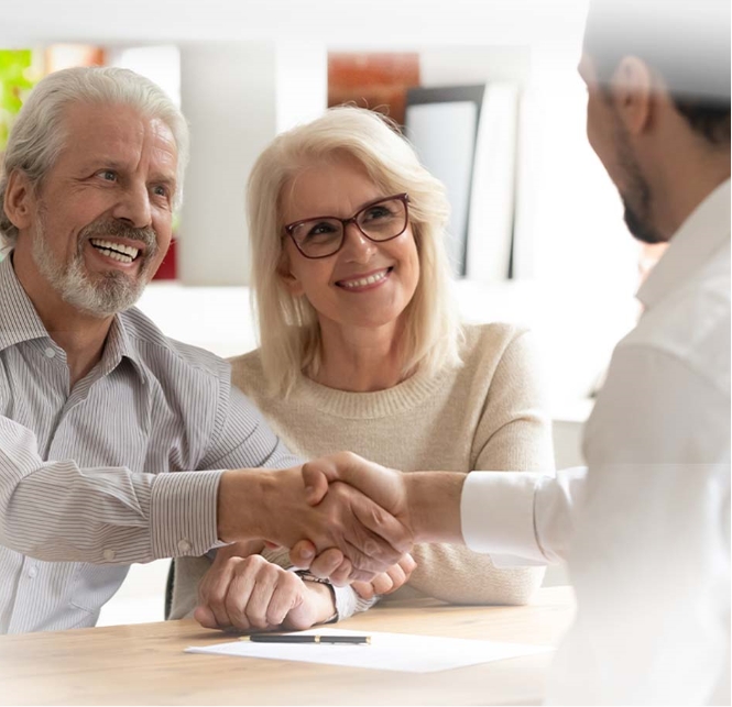 A couple speaking with their insurance agent.