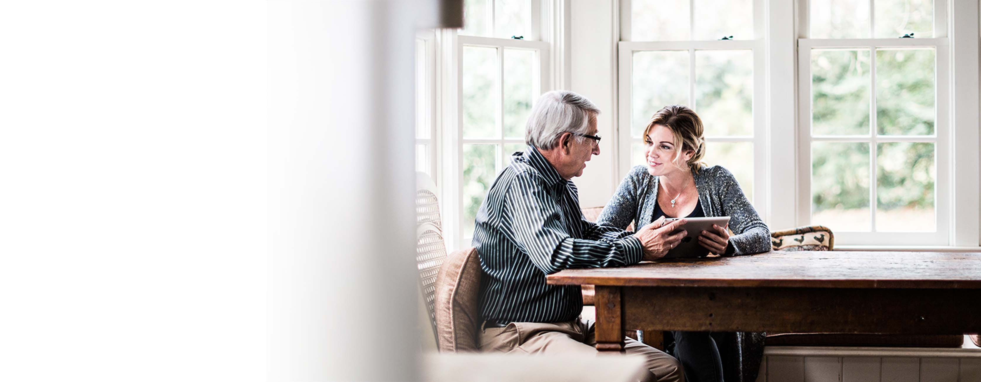Insurance agent speaking with a client.